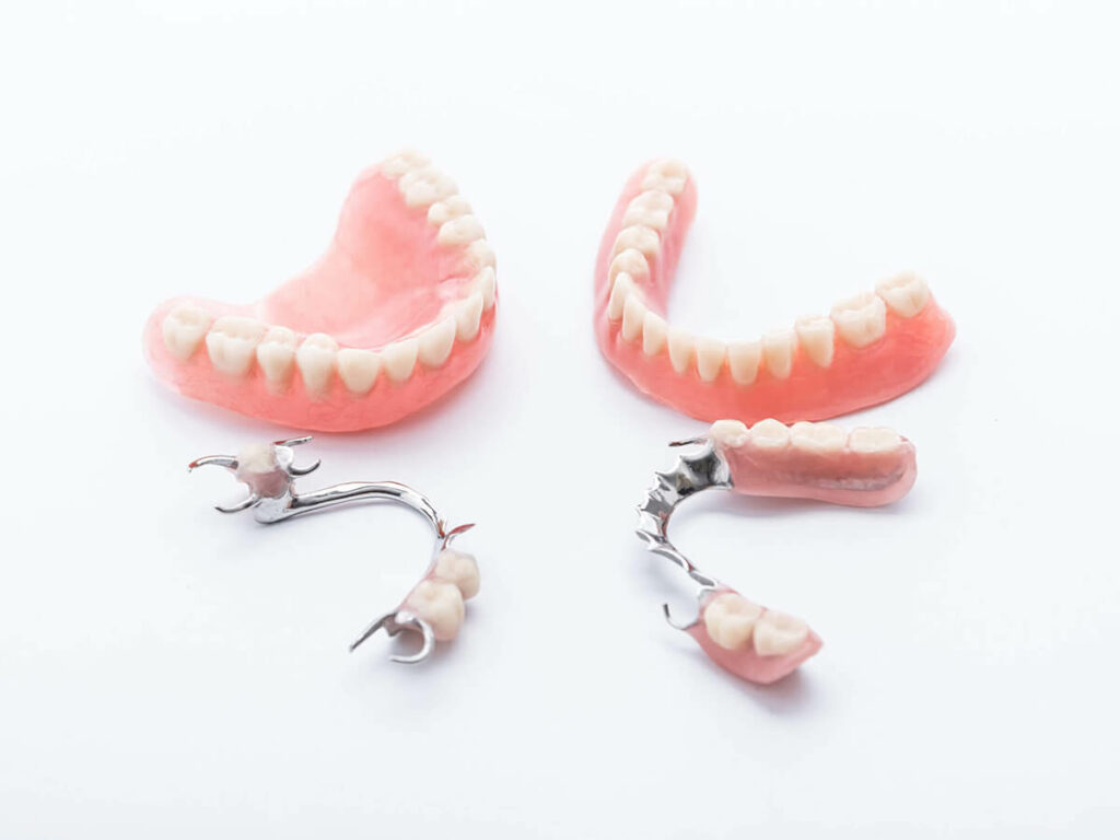 dentures laying next to partial dentures